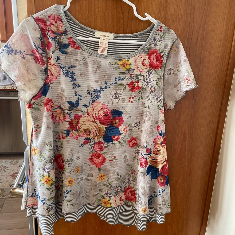 Sundance T with floral overlay.